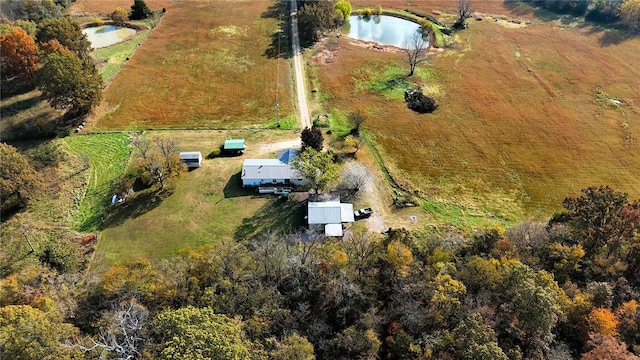 drone / aerial view featuring a water view and a rural view