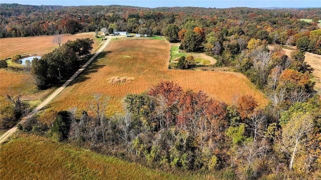 drone / aerial view featuring a view of trees