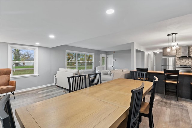 dining room with a chandelier and hardwood / wood-style floors