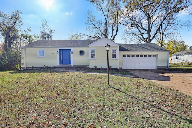 ranch-style house with a front yard and a garage