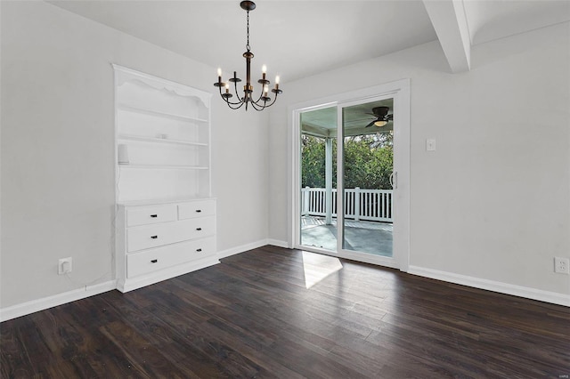 empty room featuring built in shelves, beamed ceiling, ceiling fan with notable chandelier, and dark hardwood / wood-style floors