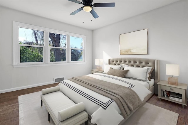 bedroom featuring ceiling fan and dark hardwood / wood-style floors