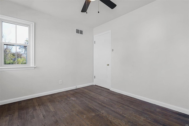 unfurnished room featuring ceiling fan and dark wood-type flooring