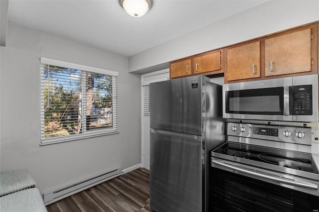 kitchen with dark hardwood / wood-style flooring, stainless steel appliances, and a baseboard heating unit