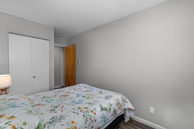 bedroom featuring a closet and wood-type flooring