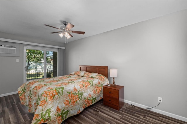 bedroom featuring a wall mounted AC, ceiling fan, and dark hardwood / wood-style floors