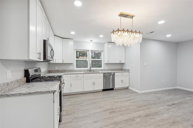 kitchen with visible vents, white cabinets, stainless steel appliances, light wood-type flooring, and recessed lighting