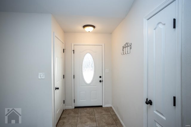 doorway featuring light tile patterned flooring