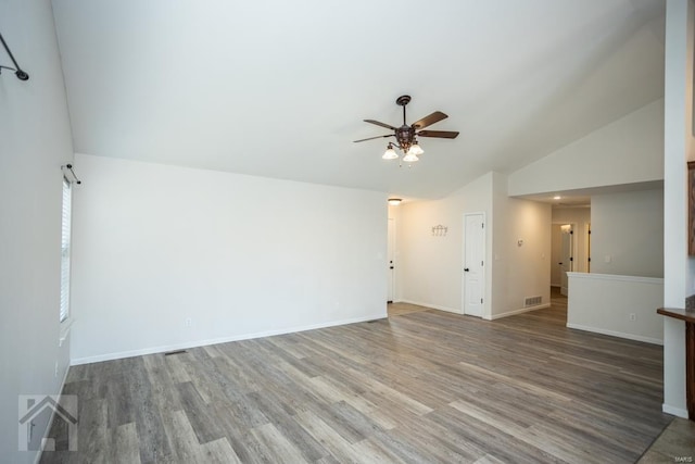 spare room featuring ceiling fan, vaulted ceiling, and hardwood / wood-style flooring