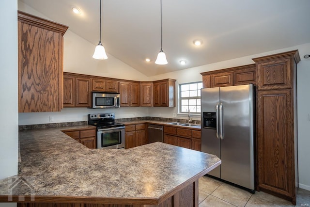 kitchen with appliances with stainless steel finishes, vaulted ceiling, sink, light tile patterned floors, and decorative light fixtures