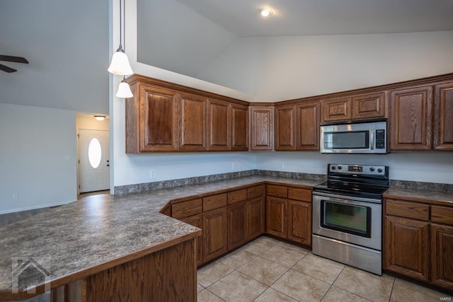 kitchen featuring ceiling fan, light tile patterned floors, kitchen peninsula, and appliances with stainless steel finishes