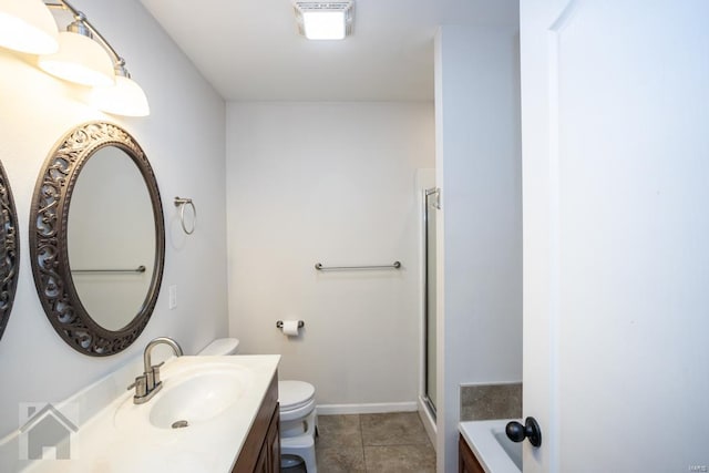 bathroom with tile patterned flooring, vanity, toilet, and walk in shower