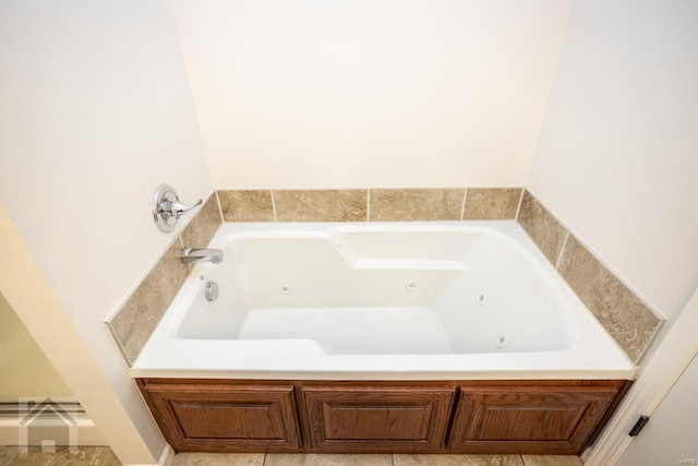 bathroom featuring a washtub