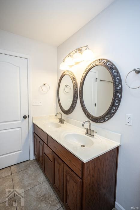 bathroom featuring tile patterned floors and vanity