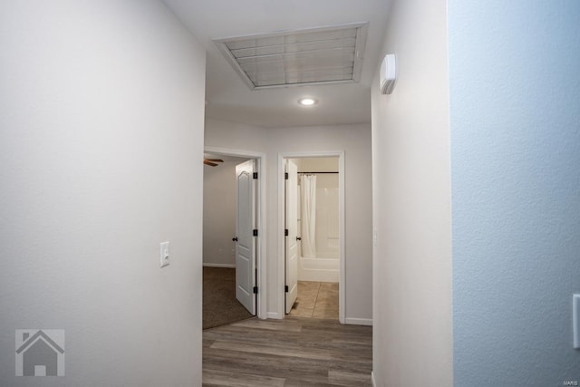 corridor with light hardwood / wood-style flooring