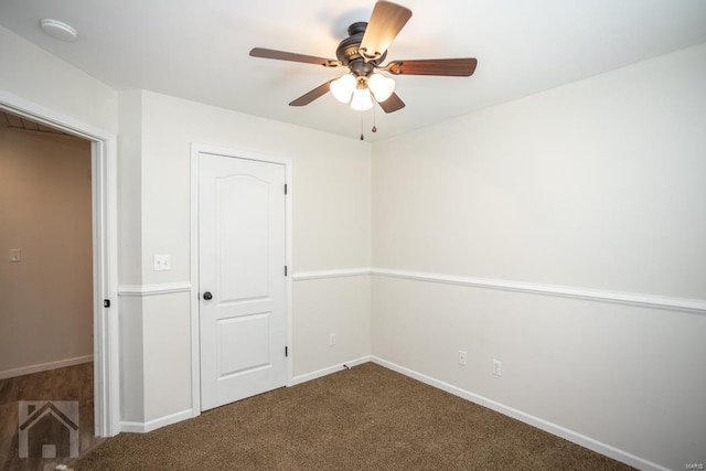 unfurnished bedroom featuring carpet, a closet, and ceiling fan