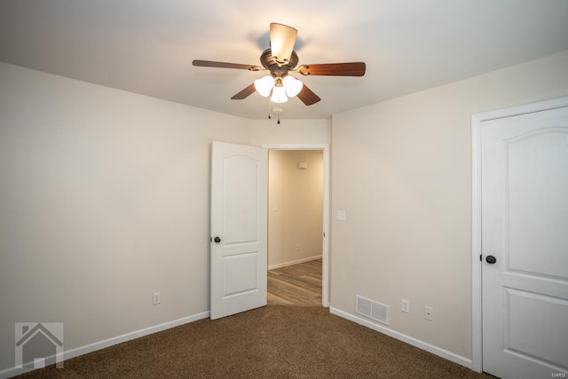 unfurnished bedroom featuring carpet and ceiling fan