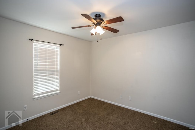 spare room featuring ceiling fan and carpet floors