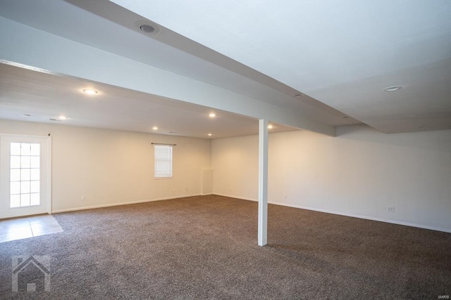 basement with carpet flooring and a healthy amount of sunlight