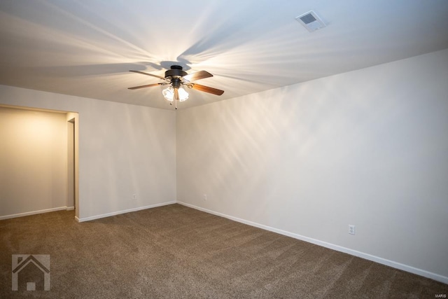 carpeted empty room featuring ceiling fan