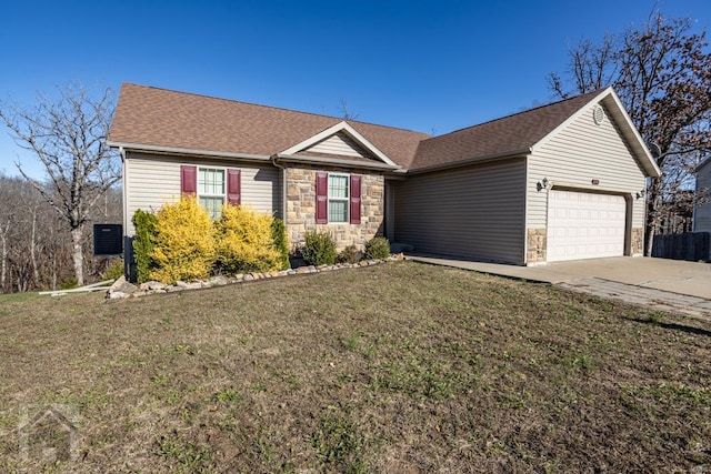 single story home featuring a front yard and a garage