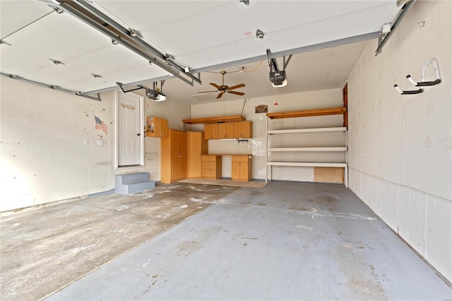 garage with a garage door opener and ceiling fan