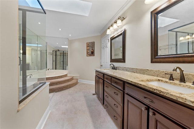 bathroom with vanity, a skylight, independent shower and bath, and ornamental molding