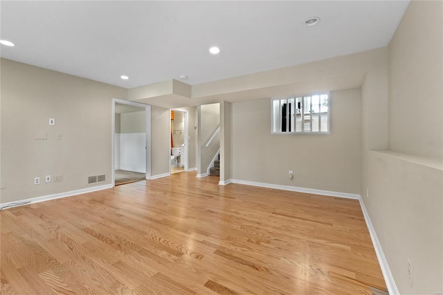 spare room featuring light hardwood / wood-style flooring