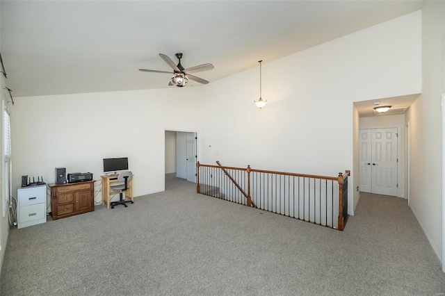 office featuring high vaulted ceiling, ceiling fan, and carpet flooring