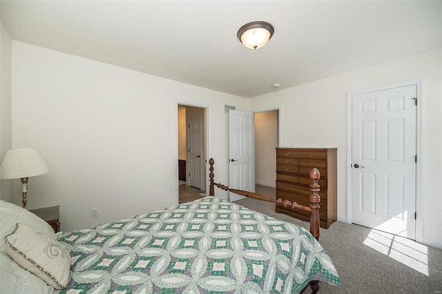 carpeted bedroom with baseboards