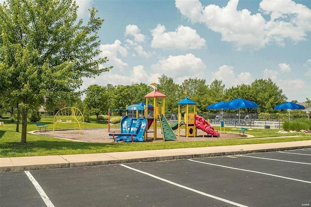 communal playground featuring a yard