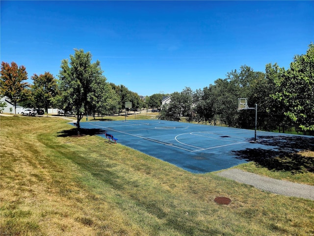 view of basketball court with a yard and community basketball court