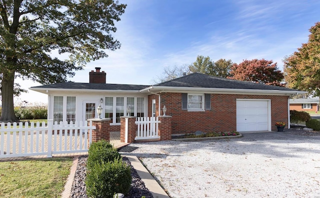 single story home featuring a garage