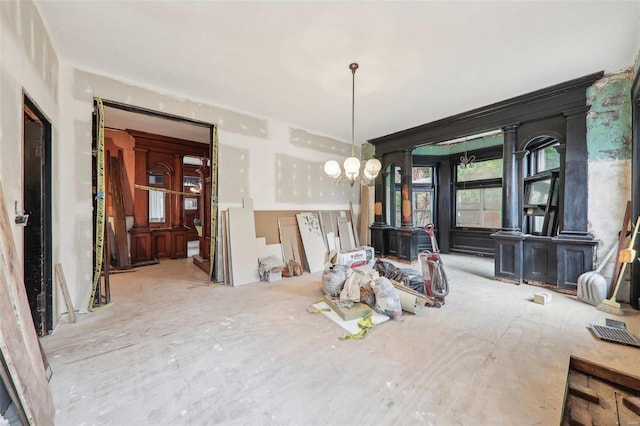 unfurnished dining area with a chandelier