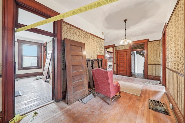 interior space featuring a chandelier and light hardwood / wood-style flooring