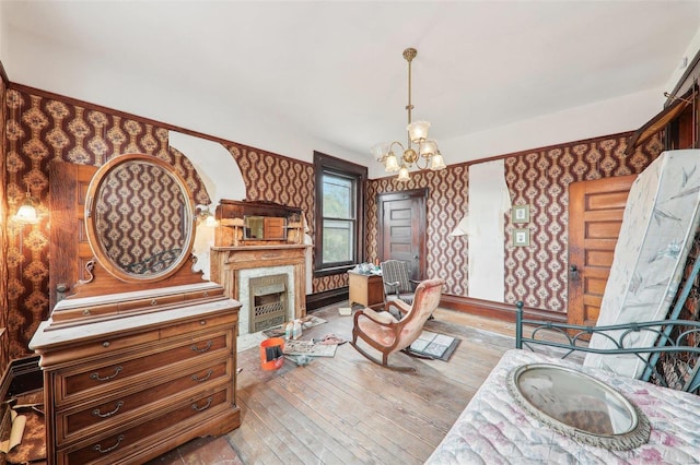 living room with light wood-type flooring and a chandelier