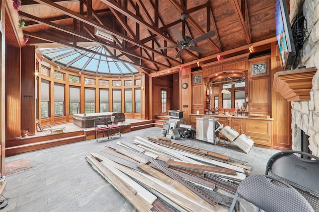 miscellaneous room featuring high vaulted ceiling, wooden walls, ceiling fan, beam ceiling, and wood ceiling