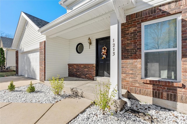 property entrance with covered porch and a garage