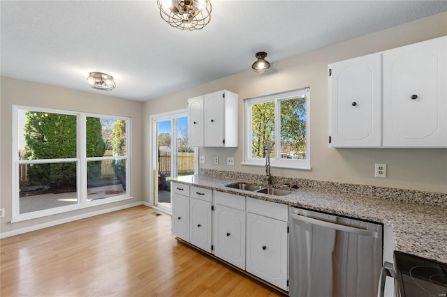 kitchen featuring dishwasher, white cabinetry, and light stone countertops