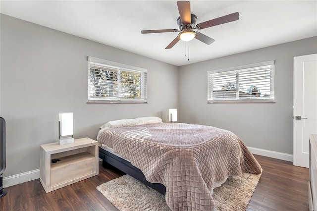 bedroom featuring ceiling fan and dark hardwood / wood-style flooring