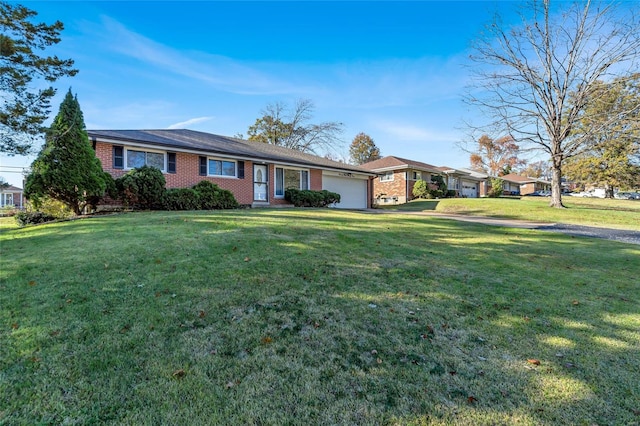 single story home with a garage and a front yard