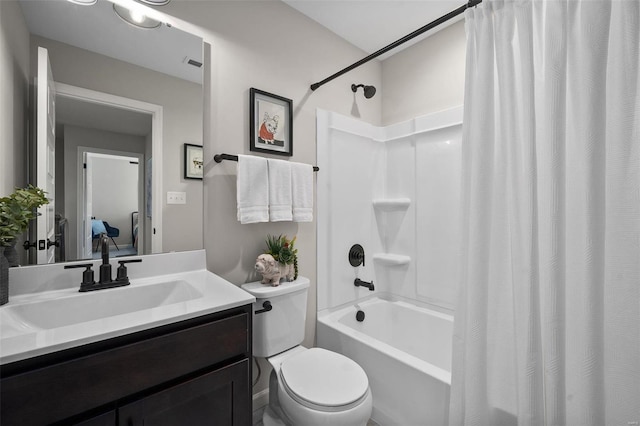 full bathroom featuring vanity, toilet, and shower / bathtub combination with curtain