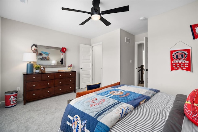 bedroom with light carpet and ceiling fan