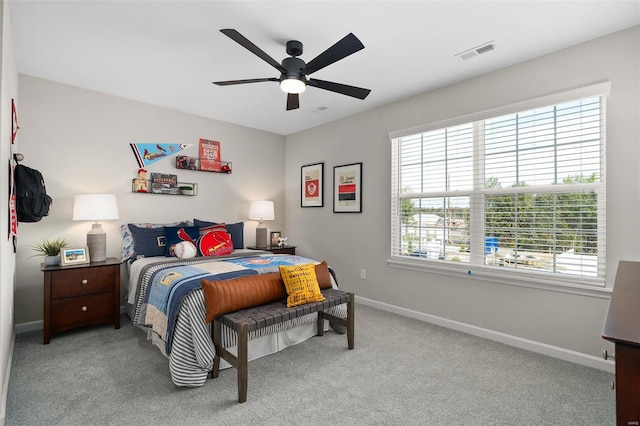 bedroom with light colored carpet and ceiling fan