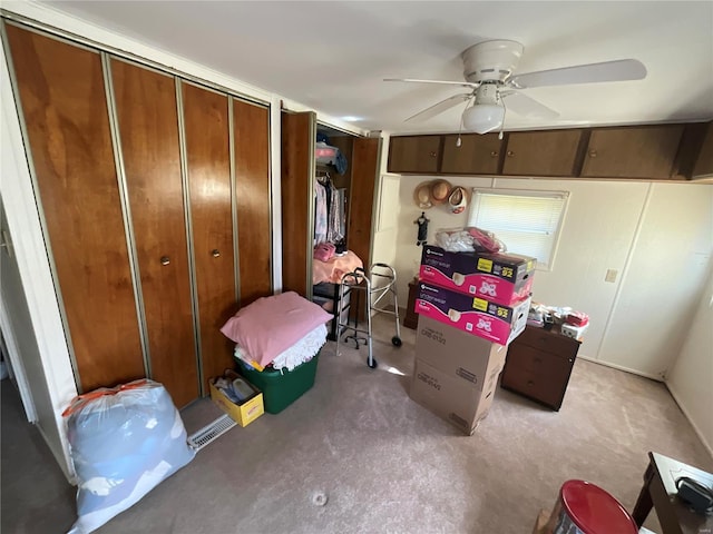 bedroom featuring ceiling fan and concrete floors