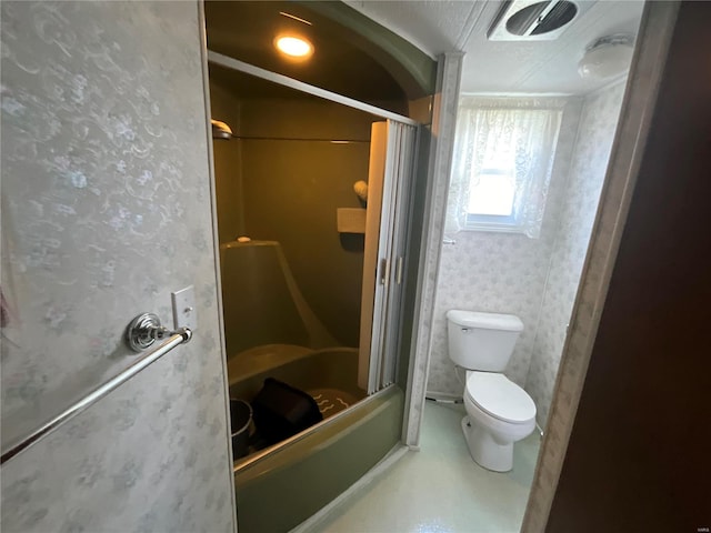 bathroom featuring walk in shower and toilet