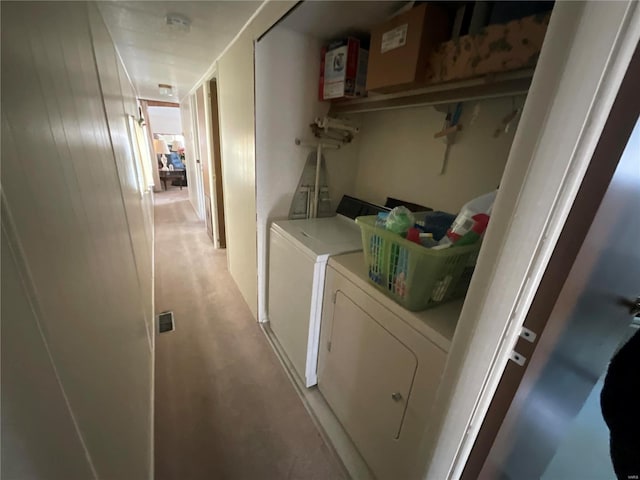 laundry area featuring washing machine and clothes dryer