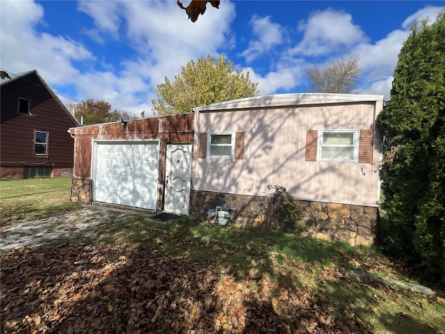 view of property exterior featuring a garage