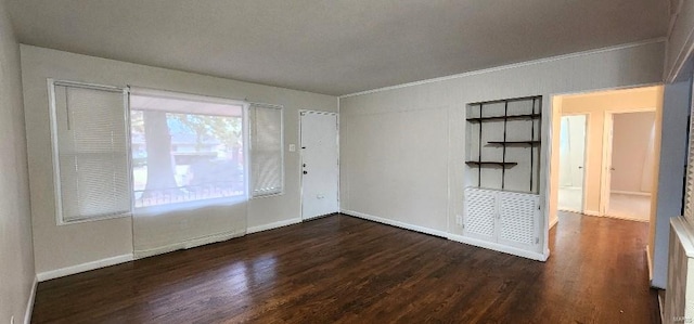 interior space featuring dark wood-type flooring and crown molding