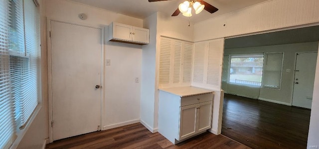 kitchen featuring white cabinets, dark hardwood / wood-style flooring, and ceiling fan